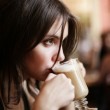 Beautiful woman drinking coffee lattee